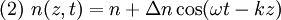 (2) \ n(z,t)=n+\Delta n \cos (\omega t - kz)\,